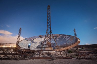 Nigth photography of a ruined setellite dish antenna in south Te clipart