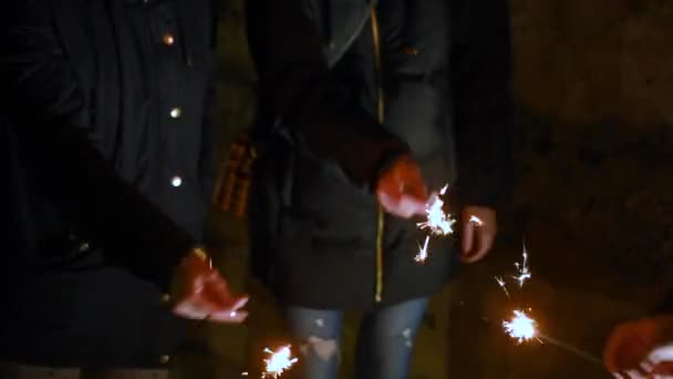 Hands Playing With Burning Sparklers In Darkness. — Stock Video