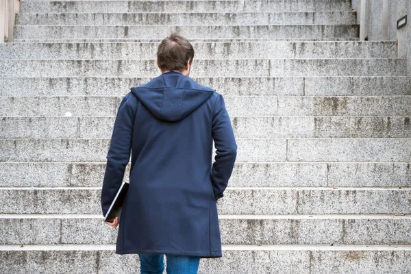 Young man Holding Computer Laptop Walking Up Stairs outdoor. — 스톡 사진