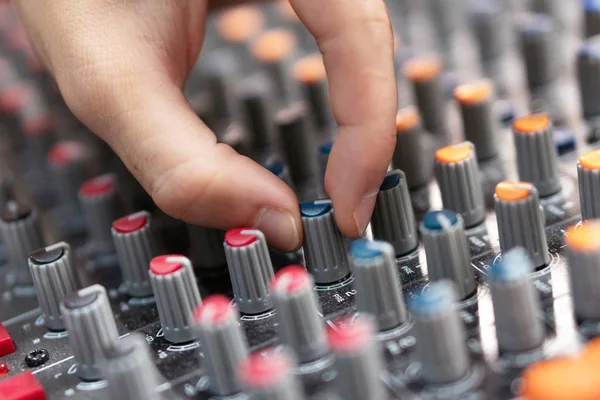 Close-up of a mixing console, hand equalizing audio channels. Professional recording studio. Working in recording studio. — Stock Photo, Image