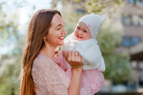 Cheerful Woman Hugs Baby Girl White Fur Coat Summer Cap — Stock Photo, Image