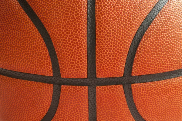 Close up shot of a basketball showing the seams — Stock Photo, Image