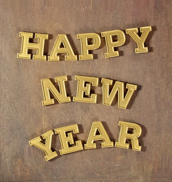 Feliz Ano Novo texto dourado — Fotografia de Stock