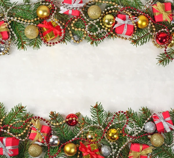 Christmas decorations on a spruce branch — Stock Photo, Image