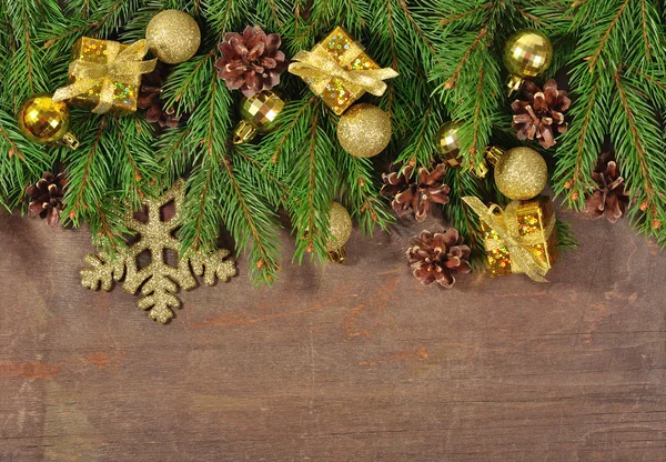 Christmas decorations and spruce branch and cones — Stock Photo, Image