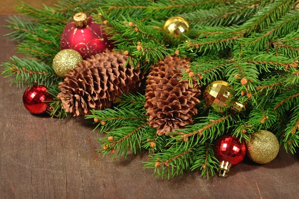 Christmas decorations and spruce branch and cones Royalty Free Stock Photos