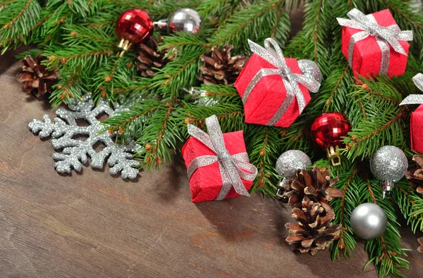 Christmas decorations and spruce branch and cones — Stock Photo, Image