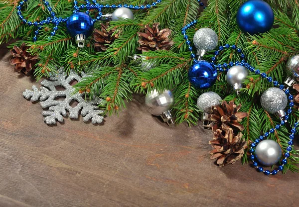 Christmas decorations and spruce branch and cones — Stock Photo, Image