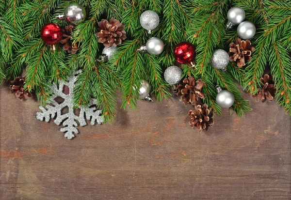 Christmas decorations and spruce branch and cones — Stock Photo, Image