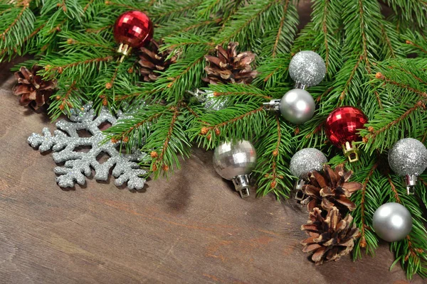 Christmas decorations and spruce branch and cones — Stock Photo, Image