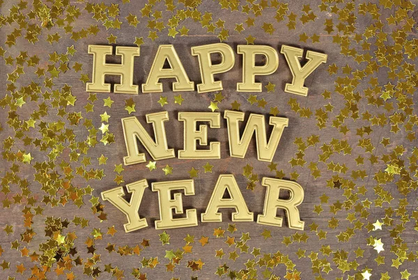 Feliz Ano Novo texto dourado e estrelas douradas — Fotografia de Stock