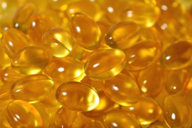 Omega-3 balık yağı kapsülleri arka plan doku olarak şişko.