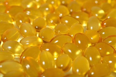 Omega-3 balık yağı kapsülleri arka plan doku olarak şişko..