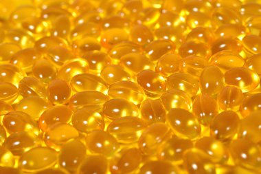 Omega-3 balık yağı kapsülleri arka plan doku olarak şişko..
