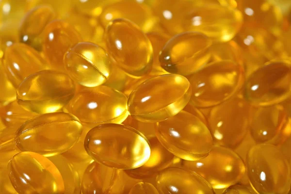 Omega-3 rybí tuk olej kapsle jako texturu pozadí — Stock fotografie