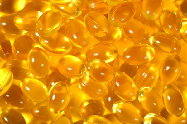 Omega-3 rybí tuk olej kapsle jako texturu pozadí — Stock fotografie