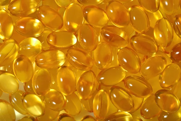 Omega-3 rybí tuk olej kapsle jako pozadí — Stock fotografie