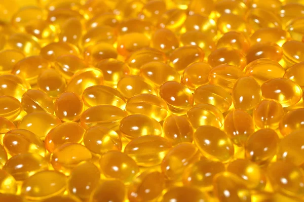 Omega-3 rybí tuk olej kapsle jako texturu pozadí. — Stock fotografie