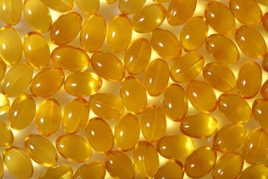Omega-3 balık yağı kapsülleri arka plan olarak şişko.
