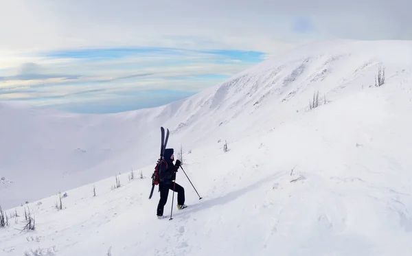 Alpine touring skier hiking in winter mountains. — Stock Photo, Image