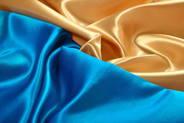 Doğal altın ve mavi saten kumaş doku — Stok fotoğraf