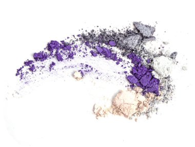 Crushed makeup on white background. The eye shadows.