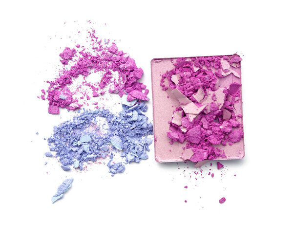 Pink purple and blue crushed eyeshadow on white background