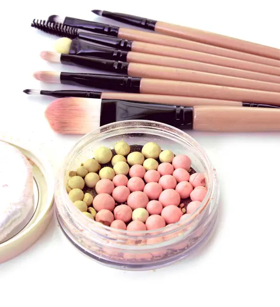 Make-up brushes set with powder balls in box on white. — Stock Photo, Image