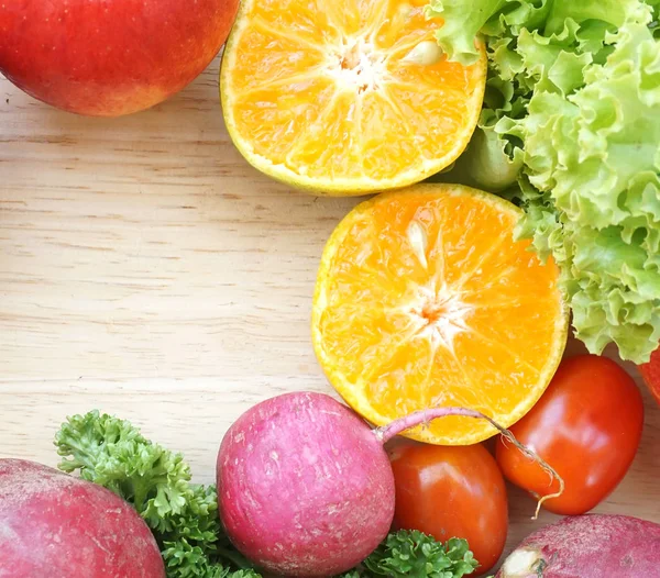 Fruits and vegetable top view on wooden table (Healthy food) — Stock Photo, Image