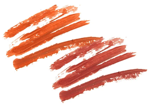 Красный и темно-коричневый штрих помады изолированы — стоковое фото
