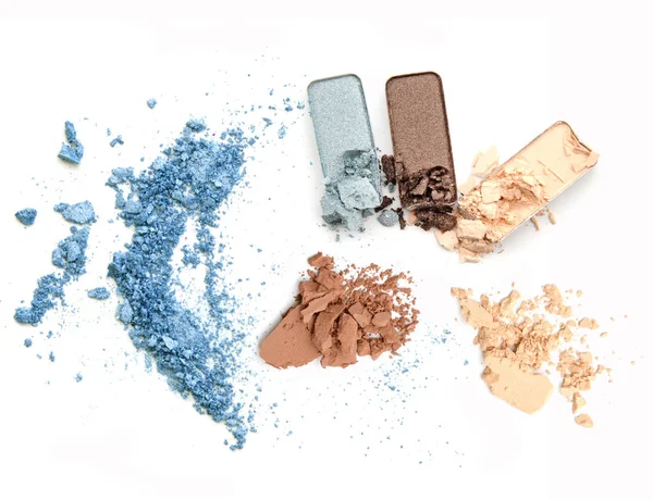 Crushed makeup on white background. The eye shadows.
