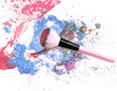 Crushed makeup on white background. The eye shadows.