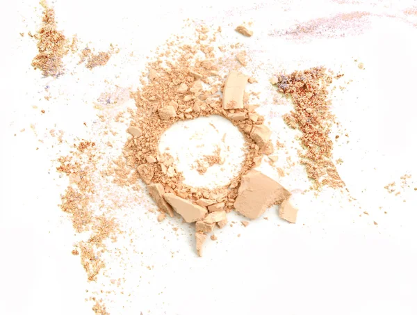 Crushed make up powder, facial cosmetic on white background — Stock Photo, Image