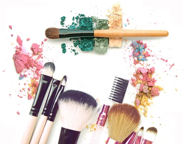 Cosmetic powder brush crushed and lipstick smear isolated on white — Stock Photo, Image