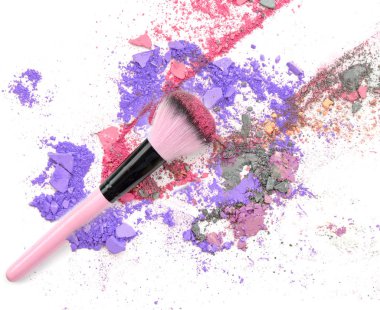 Crushed makeup on white background. The eye shadows.