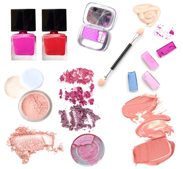 Collection of make up cosmetic products on white.