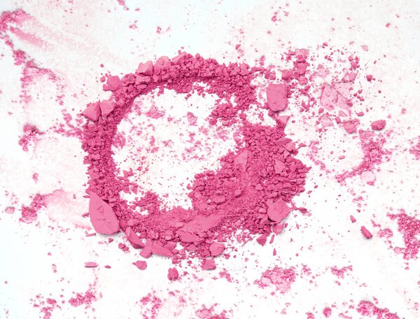 Pink powder make up. Crushed background.