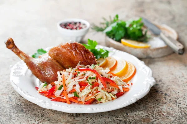 Salad of cabbage, carrots, peppers, apples and roasted duck leg — Stock Photo, Image