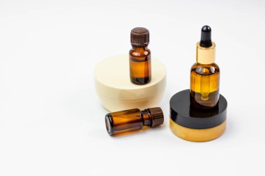 Set of cosmetic products with serum, face cream on a light background. Salon procedures concept. Minimalism.