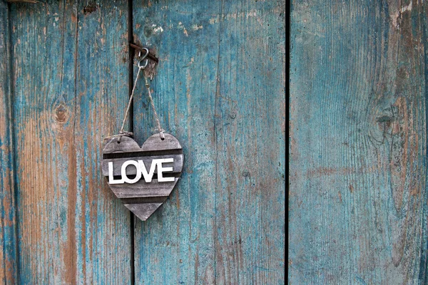 Rustic Love sign on an old blue weathered door — Stock Photo, Image