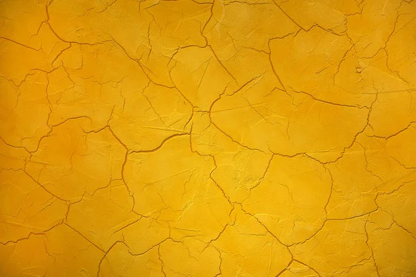 Craquelé of gebarsten verf textuur in helder geel — Stockfoto