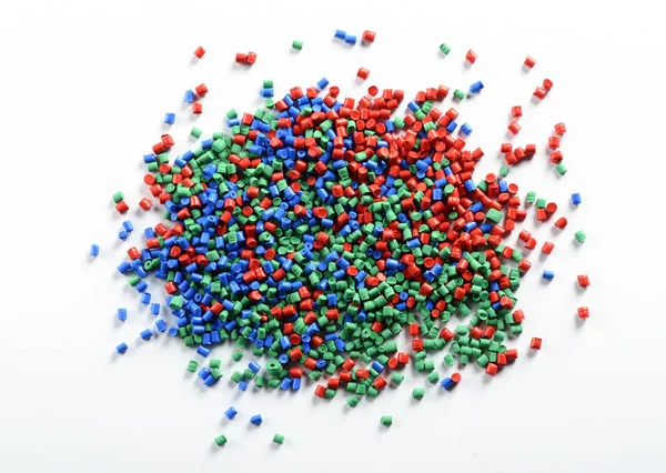 Tas de granules en plastique coloré — Photo