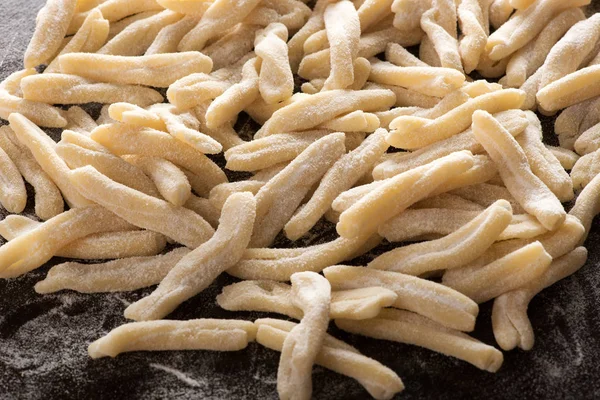 Close up of a pile of handmade caserecce pasta — Stock Photo, Image