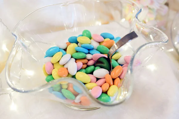 Glass bowl of sugared almonds — Stock Photo, Image