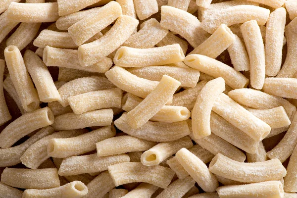 Close-up of uncooked maccheroncini pasta — Stock Photo, Image