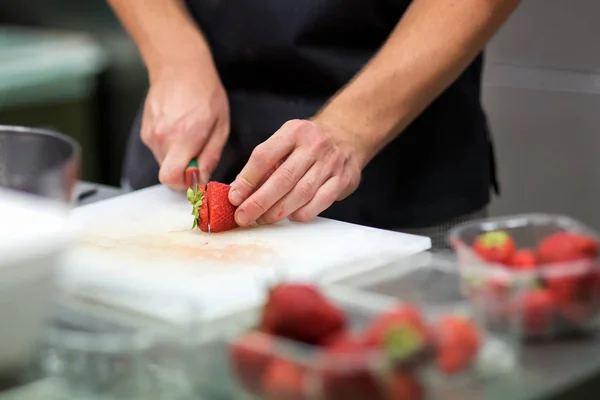 Chef preparing fresh tropical fruit salad — Stock Photo, Image