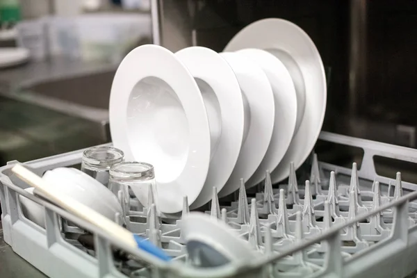 Close up view of clean plates in a dishwasher — Stock Photo, Image