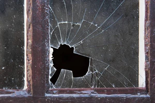 Broken window glass in close-up — Stock Photo, Image