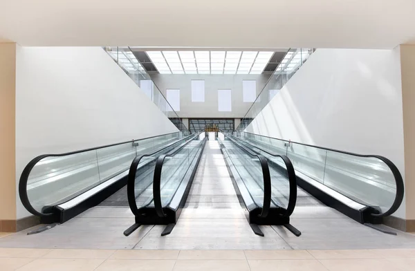 Two escalators in a commercial building