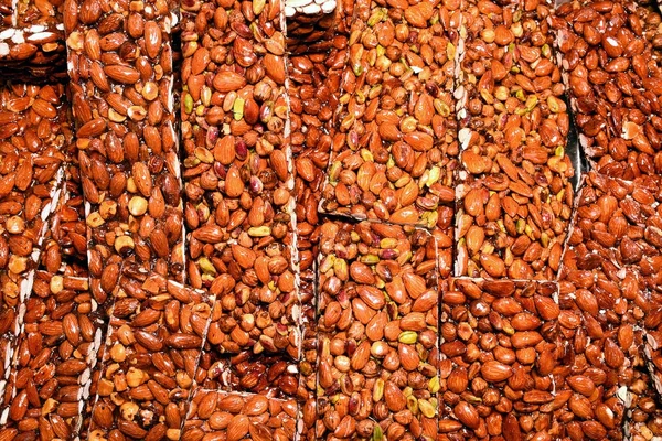 Squares of almond brittle toffee on a display — Stock Photo, Image